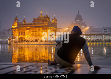 pilgrim and sacred pool Amrit Sarovar, Golden temple, Amritsar, Punjab, India Stock Photo