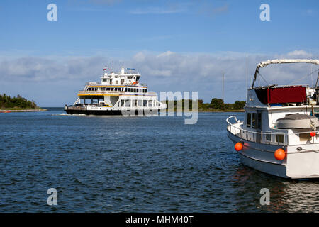 NC01579-00...NORTH CAROLINA - Ferry boat Sea Level entering Silver Lake Harbor in the town of Ocracoke on Ocracoke Island part of the Outer Banks. Stock Photo