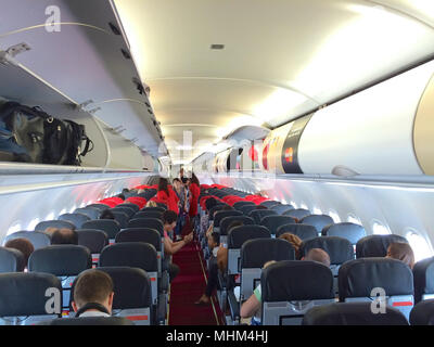 KUALA LUMPUR, MALAYSIA - APR 4th 2015: interior of AirAsia Airbus A320-200 cabin, AirAsia Berhad is a Malaysian low-cost airline headquartered near Kuala Lumpur Stock Photo