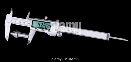 Measurement of conical steel machine part by digital caliper. Accurate gauging a replaceable center in lathe tailstock. Isolated on black background. Stock Photo