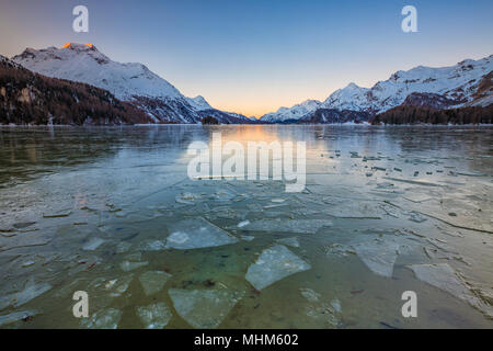 Sheets of ice on the surface of Lake Sils in a cold winter morning at dawn Upper Engadine Canton of Graubunden Switzerland Europe Stock Photo
