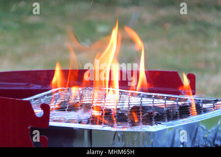 Empty grill on garden with burning embers Stock Photo - Alamy