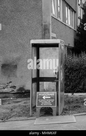 GLASGOW, SCOTLAND - OCTOBER 11th 2015: A black and white photograph of an old public telephone box in the Prospecthill circus area.