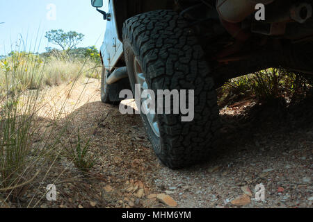 Land Rover Defender 110 driving off road, view from tires Stock Photo