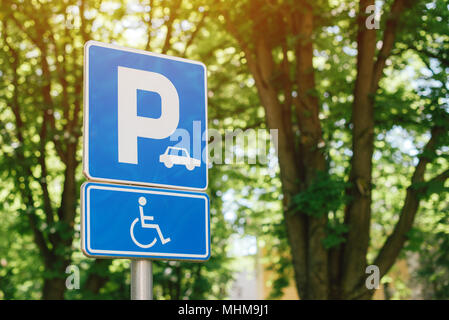 Handicap parking spot sign, reserved lot space for disabled person, selective focus Stock Photo