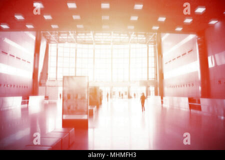 Sunny abstract blurred background : crowd people at terminal department at airport with bokeh light. Stock Photo