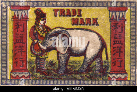 Old Japanese Matchbox label with a man with an elephant Stock Photo
