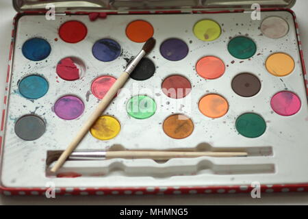 Children's watercolour paintbox and brush Stock Photo