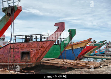 colorful rugged Ship prow on cloudy sky background Stock Photo