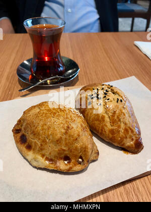 Turkish Pastry Pogaca with tea. Bakery Concept. Stock Photo
