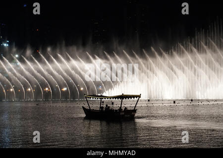 DUBAI, UAE - AUGUST 14 2017 - The show takes places every 30 minutes at the mall and is the world's second largest choreographed fountain system Stock Photo