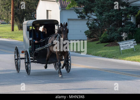 LANCASTER, USA - JUNE 25 2016 - Amish people in Pennsylvania. Amish are known for simple living with touch of nature contacy, plain dress, and relucta Stock Photo