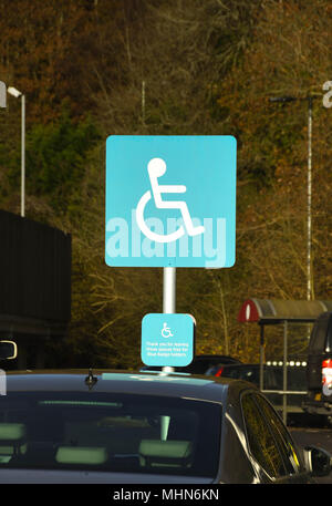 Sign at a supermarket showing a parking space reserved for drivers or passengers with a disability Stock Photo