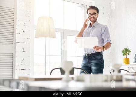 Determined businessman talking on the phone Stock Photo