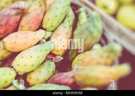 Prickly pears of the variety called bastardoni on the table of a street seller in Catania, Italy. Stock Photo