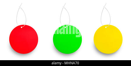 Three colored tags hanging isolated on white background. Red green and yellow colors Stock Photo