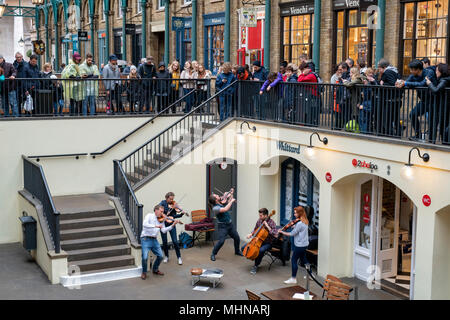 Buskers playing classical music in covent garden market building. Covent Garden, London Stock Photo