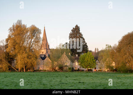 Early morning light at sunrise over St. Mary the Virgin parish church in Shipton under Wychwood Cotswolds, Oxfordshire, England Stock Photo