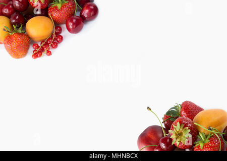 Various fresh summer berries. Ripe strawberries, redcurrants, apricots, nectarines and cherries on white background. Berries and fruits with copy spac Stock Photo