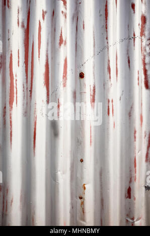 Weathered corrugated metal sheet, abstract background. Stock Photo