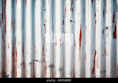 Weathered corrugated metal sheet, abstract background. Stock Photo