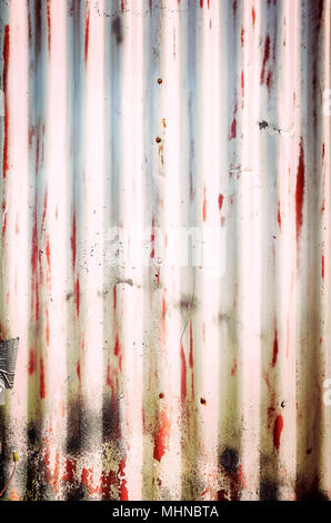 Weathered corrugated metal sheet, abstract background. Stock Photo