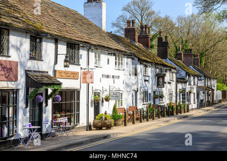 Prestbury is a historic village in Cheshire East.  This is the main street with shops and restaurants Stock Photo