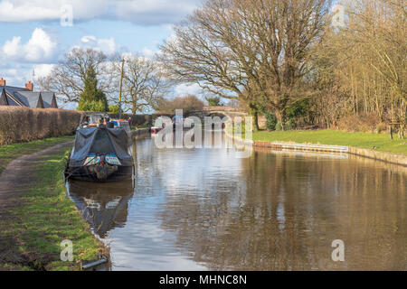 Narrow boats moored on the Macclesfield Canal near Bollington in  Cheshire.  The canal is a popular waterway used by visitors to Cheshire Stock Photo