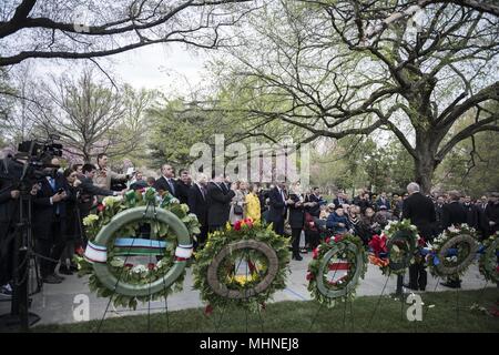 Participants attend a wreath-laying ceremony at The Spirit of the Elbe marker in Section 7A of Arlington National Cemetery, Arlington, Virginia, April 24, 2018, April 24, 2018. The marker reads, 'In recognition of the cooperation by American, Soviet and Allied armed forces during World War II. This marker symbolizes the link up of Soviet and American elements at the Elbe River on 15 April 1945. In tribute to the partnership in the battle against tyranny. ' (U.S Army photo by Elizabeth Fraser / Arlington National Cemetery / released). () Stock Photo