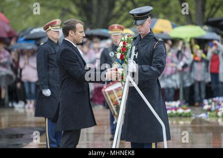 French President Emmanuel Macron participates in a wreath-laying ceremony at the Tomb of the Unknown Soldier at Arlington National Cemetery, Arlington, Virginia, April 24, 2018, April 24, 2018. President Macron's visit to Arlington National Cemetery was part of the first official State Visit from France since President Francois Hollande came to Washington in 2014. President Macron along with his wife, Brigitte Macron, also visited the gravesite of former President John F. Kennedy. (U.S. Army photo by Elizabeth Fraser / Arlington National Cemetery / released). () Stock Photo