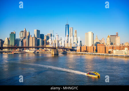 Brooklyn bridge and Manhattan at sunny day Stock Photo