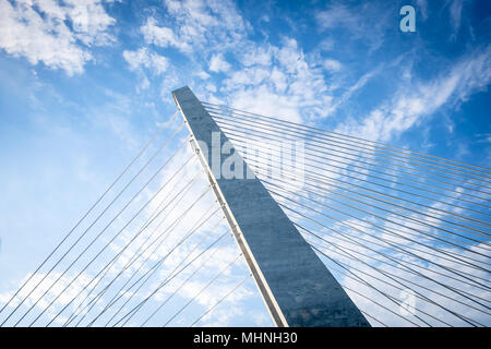 Barra da Tijuca Stayed Bridge seen from bellow again blue sky with scattered clouds. Rio de Janeiro, Brazil. Stock Photo