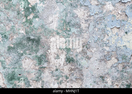 Old dirty cement wall with paint residues Stock Photo