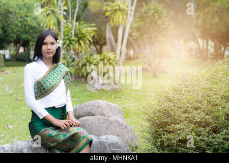 Beautiful Laos girl in Laos costume ,Asian woman wearing traditional Laos culture,vintage style,traditional suit. Stock Photo