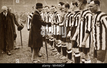 Albert, Duke of York (1895-1952) (later King George VI) -  shakes hand with the Newcastle United side before the FA Cup Final at Wembley Stadium (the second final held at the Stadium) before they took on (and defeated) Aston Villa.     Date: 1924 Stock Photo