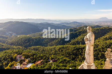 Sculpture Apostle and mountains near Barcelona Stock Photo