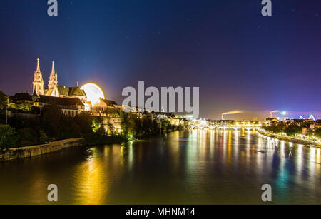 View of Basel over the Rhine by night - Switzerland Stock Photo