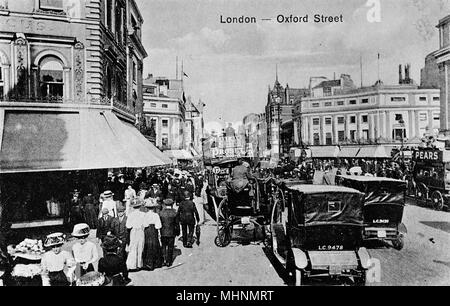 Busy day in Oxford Street, Central London, with traffic and pedestrians.      Date: circa 1910 Stock Photo