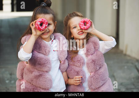 stylish funny little girls on the street Stock Photo