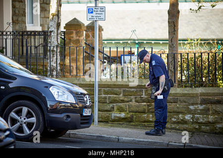 Accrington Council  Civil Enforcement Officer doing street parking duties Stock Photo