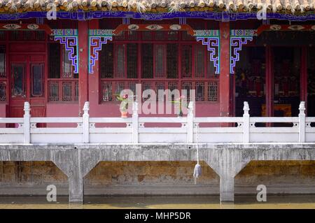 Anthurium plants with red flowers on the bridge of Yuantong Temple (Kunming, Yunnan, China) Stock Photo