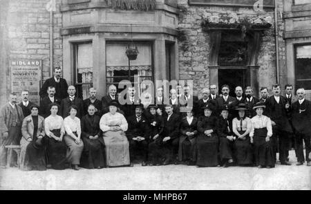 A group of people from Chesterfield England, posing for group photograph outside public house in 1914. Old photograph Stock Photo