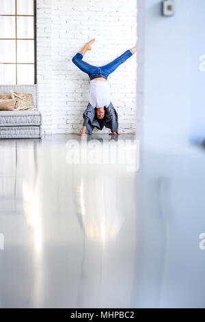 A handsome young male Ballet dancer practicing in a Loft style Apartment Stock Photo