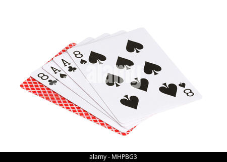 The poker hand dead man's hand a two-pair hand of black eights and aces with an unknown card, isolated on white background. Stock Photo