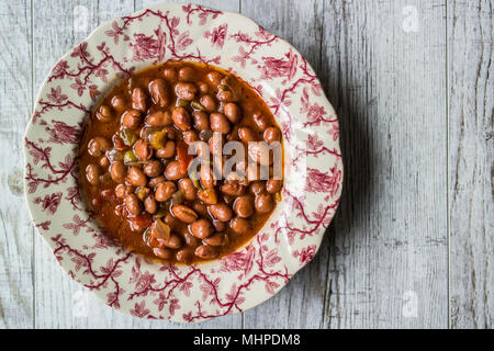 Bean stew / Turkish Barbunya Pilaki in a  plate (portion). Stock Photo