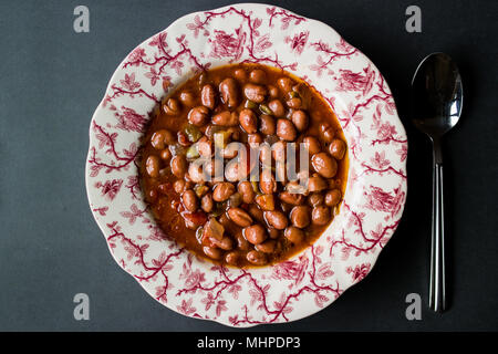 Bean stew / Turkish Barbunya Pilaki in a  plate (portion). Stock Photo