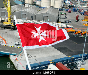 The Maltese flag flying on Celebrity Eclipse, docked in Dublin Port, Ireland Stock Photo