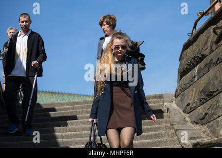 WARSAW, POLAND - APRIL 28, 2018: People go down the stairs in the old town Stock Photo