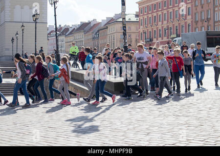 WARSAW, POLAND - APRIL 28, 2018: Excursion of schoolchildren in the old town Stock Photo