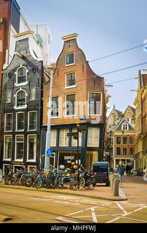 AMSTERDAM, NETHERLANDS, APRIL, 23 2018: Outdoor view of black wooden house in the begijnhof dowtown